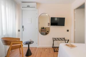 TV a/nebo společenská místnost v ubytování Granada Suites by Olala Homes