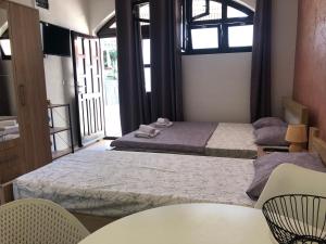 Postel nebo postele na pokoji v ubytování Apartman Cmiljanic