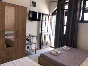 Postel nebo postele na pokoji v ubytování Apartman Cmiljanic