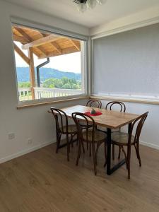 a dining room with a table and chairs and a window at domki-sopotnia in Sopotnia Wielka +37 photos