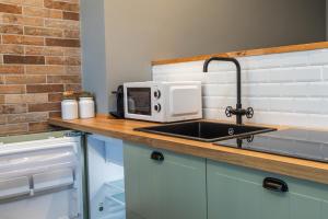 Kuchyň nebo kuchyňský kout v ubytování New Design Studio - Prada & Duomo a pochi minuti