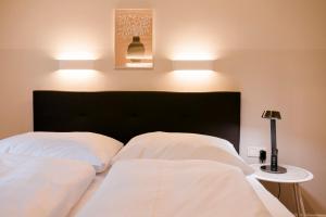 Postel nebo postele na pokoji v ubytování Hotel Villa Solln
