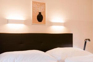 Postel nebo postele na pokoji v ubytování Hotel Villa Solln
