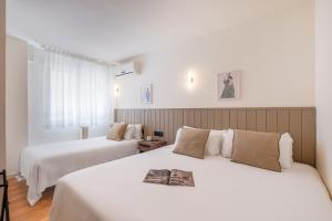 Postel nebo postele na pokoji v ubytování Granada Suites by Olala Homes