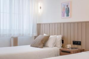 Postel nebo postele na pokoji v ubytování Granada Suites by Olala Homes