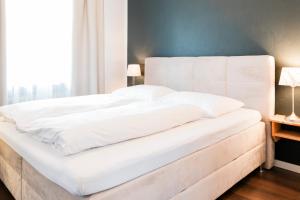 Postel nebo postele na pokoji v ubytování Hotel Villa Solln