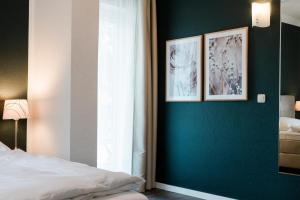 Postel nebo postele na pokoji v ubytování Hotel Villa Solln