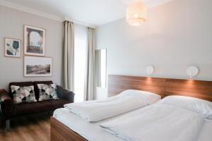 Postel nebo postele na pokoji v ubytování Hotel Villa Solln