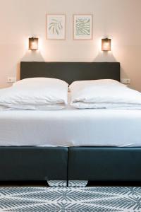 Postel nebo postele na pokoji v ubytování Hotel Villa Solln