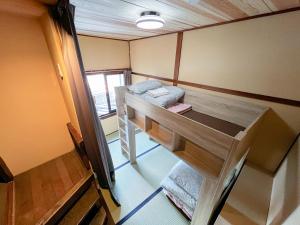 Voodi või voodid majutusasutuse Hostel Miyagawa by Murasaki toas