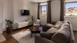 a living room with a couch and a table at La Grisha in Mali Lošinj