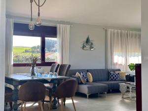a living room with a couch and a table at Vela Bianca - 12807 in Ajo