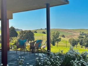 a porch with chairs and a view of a field at Vela Bianca - 12807 in Ajo