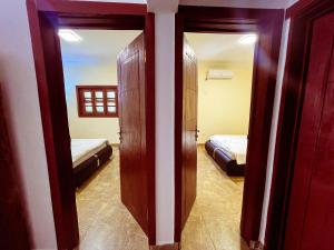 Postel nebo postele na pokoji v ubytování Tchada- Duplex