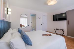 Postel nebo postele na pokoji v ubytování Granada Suites by Olala Homes