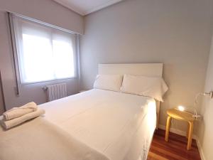 Łóżko lub łóżka w pokoju w obiekcie 4J - Ourense Centro con parking