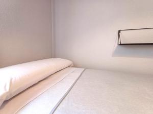 Łóżko lub łóżka w pokoju w obiekcie 4J - Ourense Centro con parking