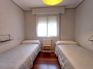 Łóżko lub łóżka w pokoju w obiekcie 4J - Ourense Centro con parking