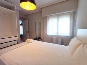 Łóżko lub łóżka w pokoju w obiekcie 4J - Ourense Centro con parking