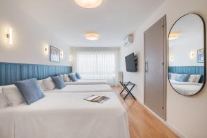 Postel nebo postele na pokoji v ubytování Granada Suites by Olala Homes
