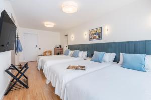 Postel nebo postele na pokoji v ubytování Granada Suites by Olala Homes