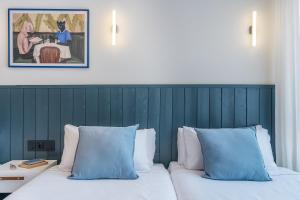 Postel nebo postele na pokoji v ubytování Granada Suites by Olala Homes