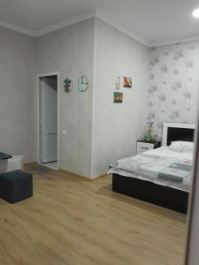 Postel nebo postele na pokoji v ubytování Akhaltsikhe hotel “Sunny House”