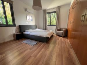 Cama ou camas em um quarto em Julipapas Gardens