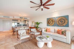 a living room with a couch and a table at Apt with picuzzi in Cap Cana at Punta Palmera BA5 in Punta Cana