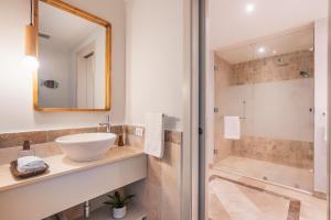 a bathroom with a sink and a shower at Apt with picuzzi in Cap Cana at Punta Palmera BA5 in Punta Cana