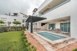 a swimming pool in the backyard of a house at Apt with picuzzi in Cap Cana at Punta Palmera BA5 in Punta Cana