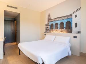 Postel nebo postele na pokoji v ubytování B&B HOTEL Mantova