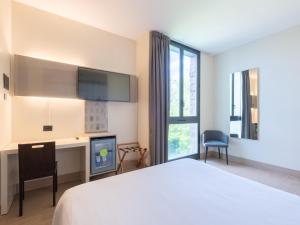 Postel nebo postele na pokoji v ubytování B&B HOTEL Mantova