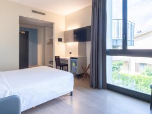 Postel nebo postele na pokoji v ubytování B&B HOTEL Mantova