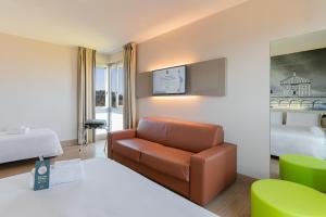 A bed or beds in a room at B&B Hotel Firenze City Center