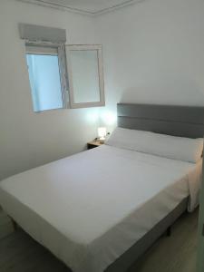 Postel nebo postele na pokoji v ubytování SuecaRoom