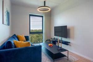 TV a/nebo společenská místnost v ubytování Penthouse apartment with an amazing view