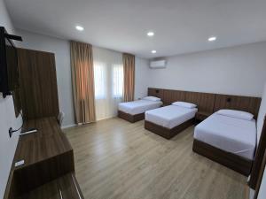 Postel nebo postele na pokoji v ubytování Hotel Aleks
