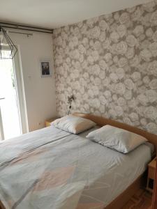 Postel nebo postele na pokoji v ubytování Apartments Lera