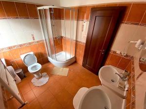 Kúpeľňa v ubytovaní Garni Hotel Tatramonti + 37 fotografií