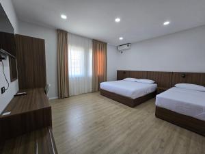 Postel nebo postele na pokoji v ubytování Hotel Aleks