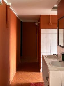 a bathroom with a sink and two sinks at Cha Na Stay at Merry V in Bangkok