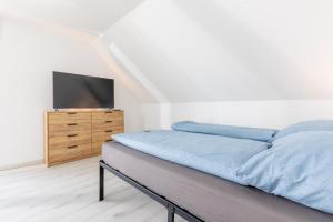 Μια τηλεόραση ή/και κέντρο ψυχαγωγίας στο Pitlane-Apartment 2 +3 φωτογραφίες