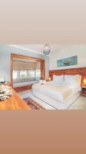 A bed or beds in a room at Triangulo Hotel