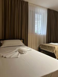 Ένα ή περισσότερα κρεβάτια σε δωμάτιο στο Birds Hostel