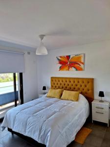 Postel nebo postele na pokoji v ubytování Departamento con increíble vista a la Cordillera