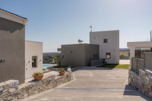 a view of two buildings from the street at Phyllion Boutique Villas in Heraklion