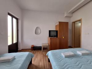 Postel nebo postele na pokoji v ubytování Studio Apartments Oleg Ohrid