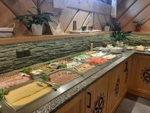 a buffet line with many different types of food at Willa Marti GOLD in Zakopane