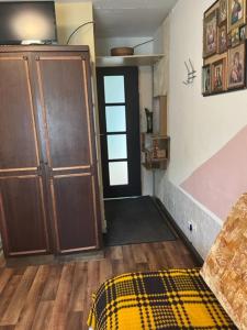 a room with a door and a rug on the floor at Apartments Londa in Jūrmala